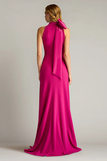 Sleek crepe sheath halter neck sleeveless open back floor length evening dress with oversized satin bow and train