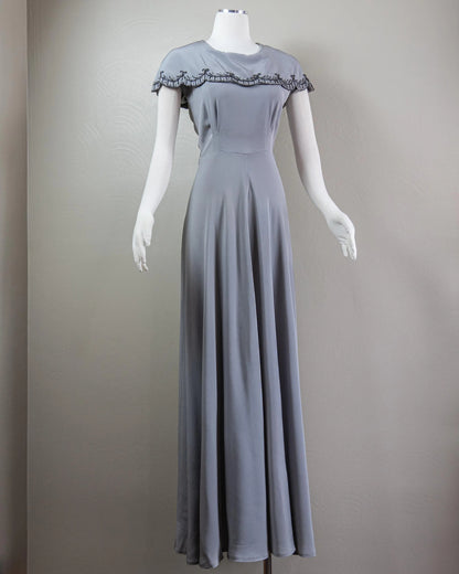 Vintage-Inspired Satin Evening Dress with Beaded Capelet Collar and Flowing Skirt