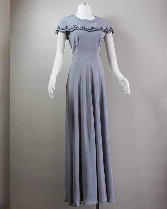 Vintage-Inspired Satin Evening Dress with Beaded Capelet Collar and Flowing Skirt