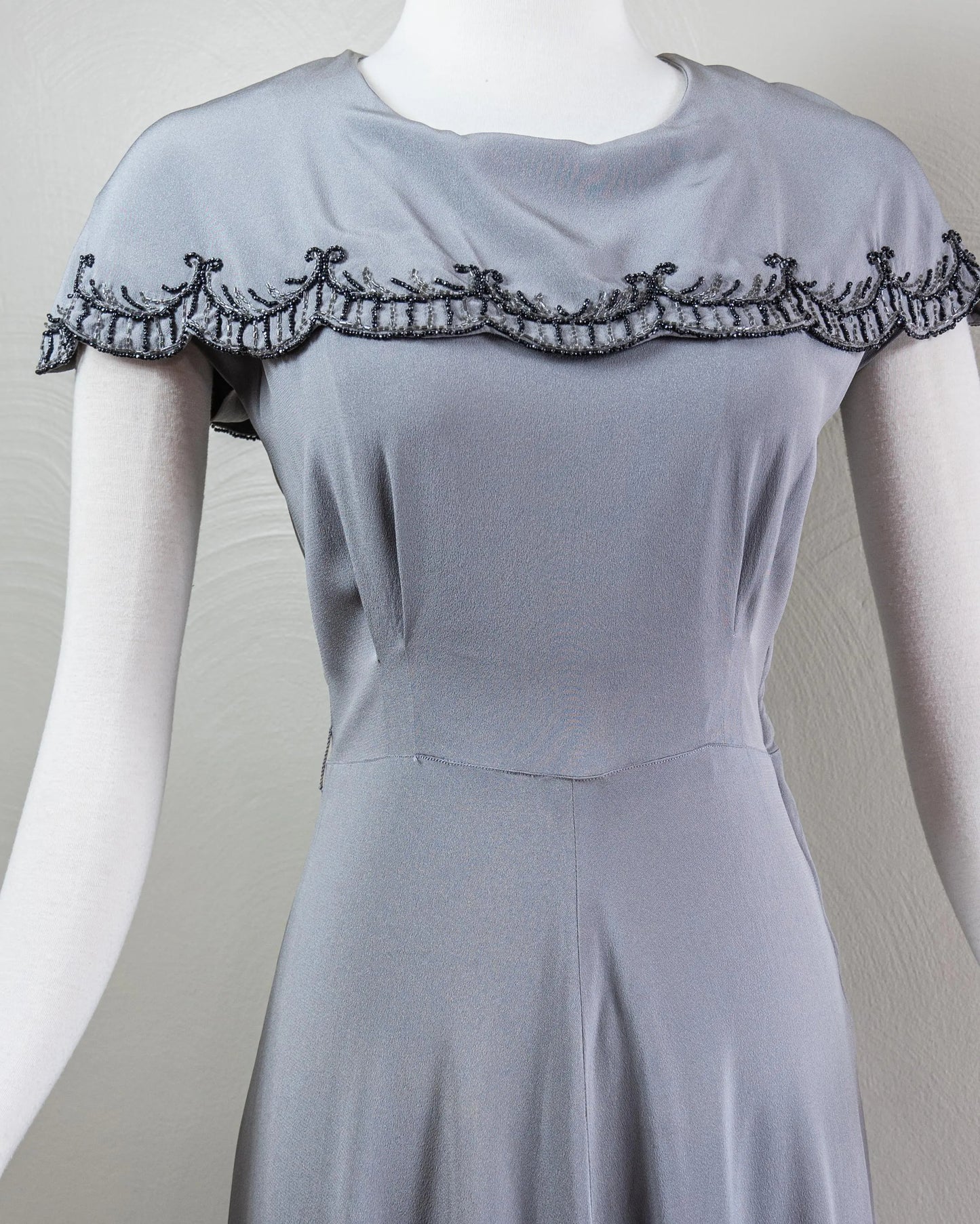 Vintage-Inspired Satin Evening Dress with Beaded Capelet Collar and Flowing Skirt