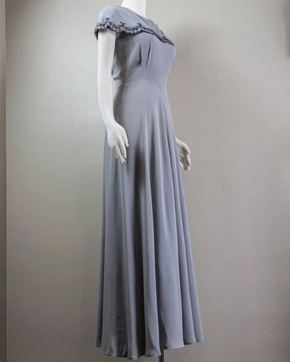 Vintage-Inspired Satin Evening Dress with Beaded Capelet Collar and Flowing Skirt