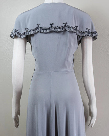 Vintage-Inspired Satin Evening Dress with Beaded Capelet Collar and Flowing Skirt