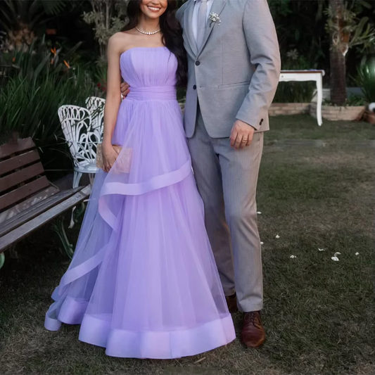 Full-length view of a whimsical lavender tulle A-line prom dress.