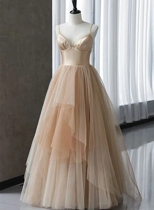 Whimsical tulle ball gown prom dress with sweetheart neckline and spaghetti straps.