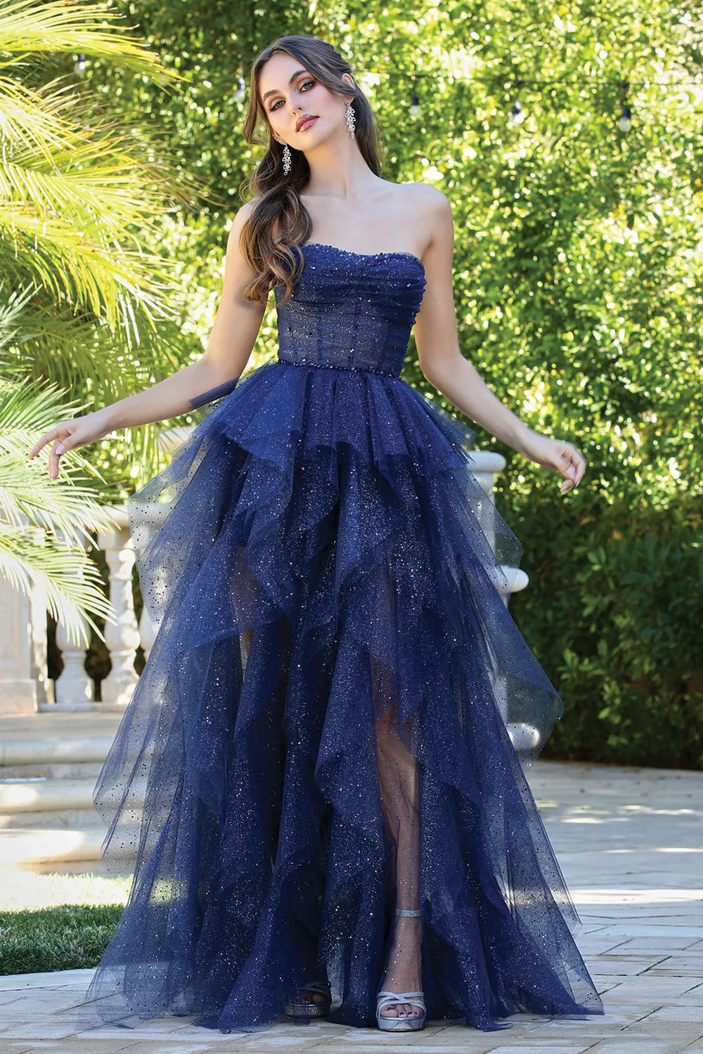 Whimsical strapless glitter tulle evening dress with corset bodice, layered ruffle skirt and lace-up back