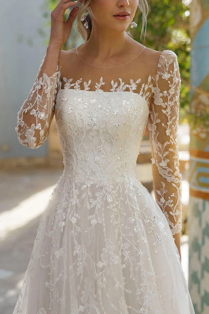 Line illusion neckline long sleeved lace trailing wedding dress